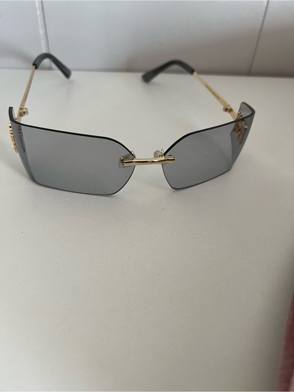 Miu Miu
Miu Miu MU 54YS Rimless Sunglasses with Gray Lenses and Gold Accents